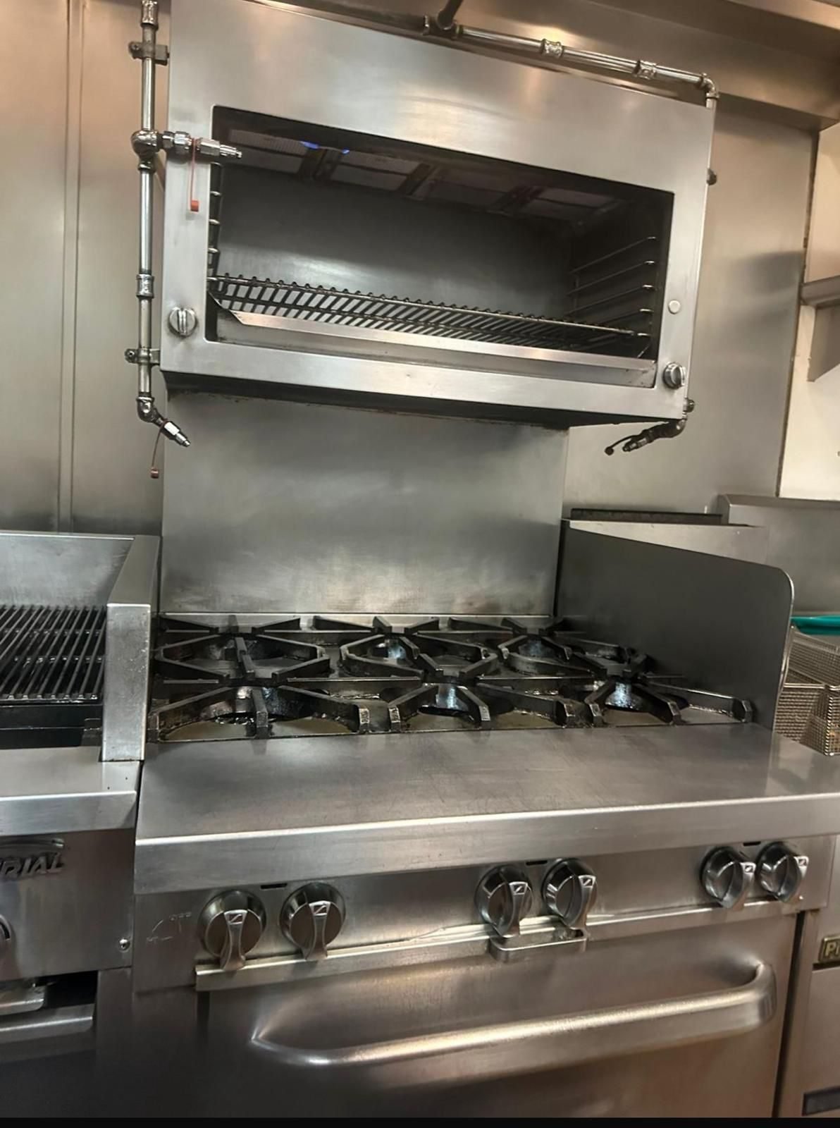 Salamander grill and range cleaned to bare stainless steel